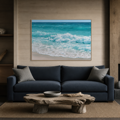 Wide turquoise wave artwork above a navy sofa with gray pillows and a driftwood coffee table