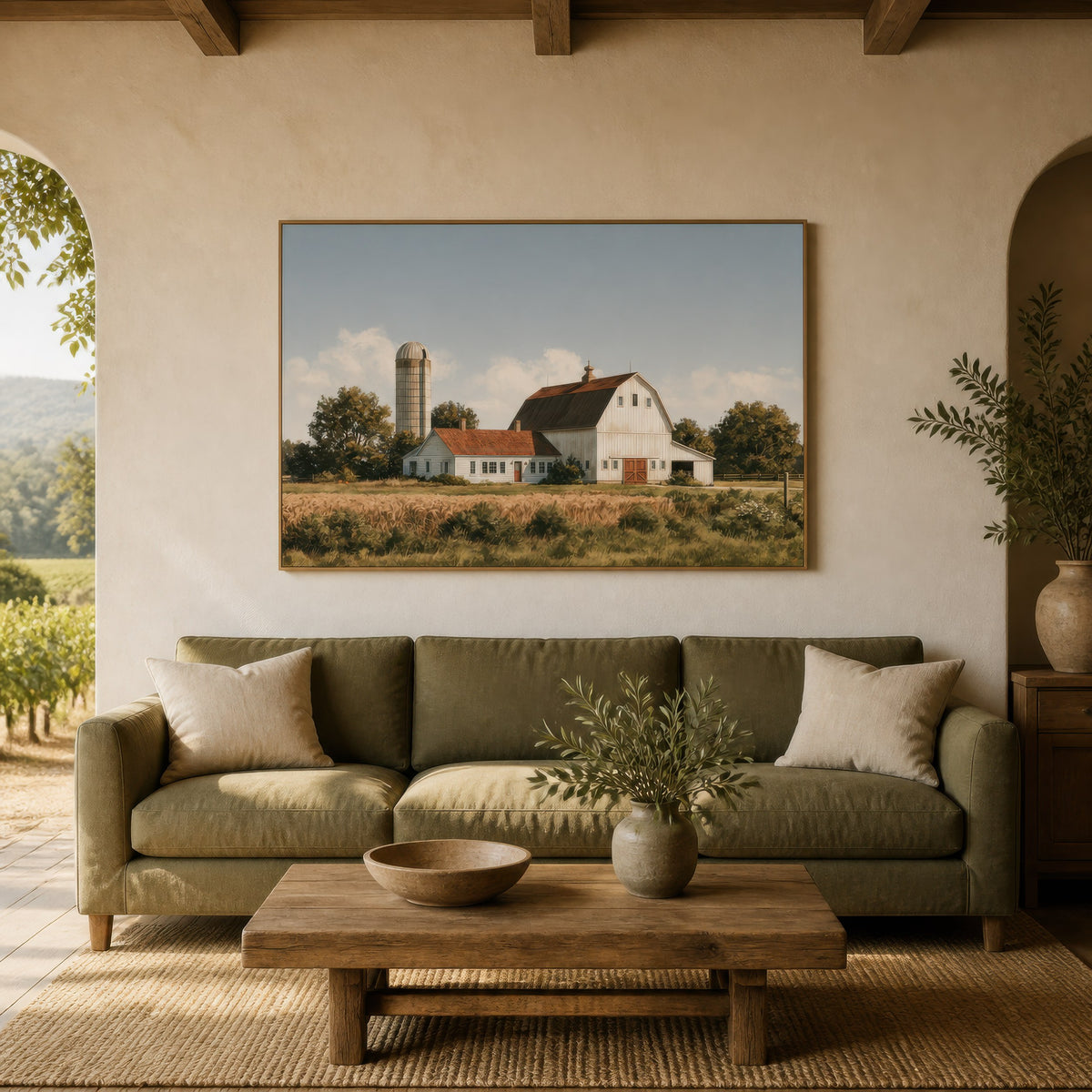 Amber grain silo above an olive green sofa on a cream plaster wall with an arch