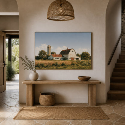 Amber grain silo above a pale wood console in an entryway with a jute rug and a pendant