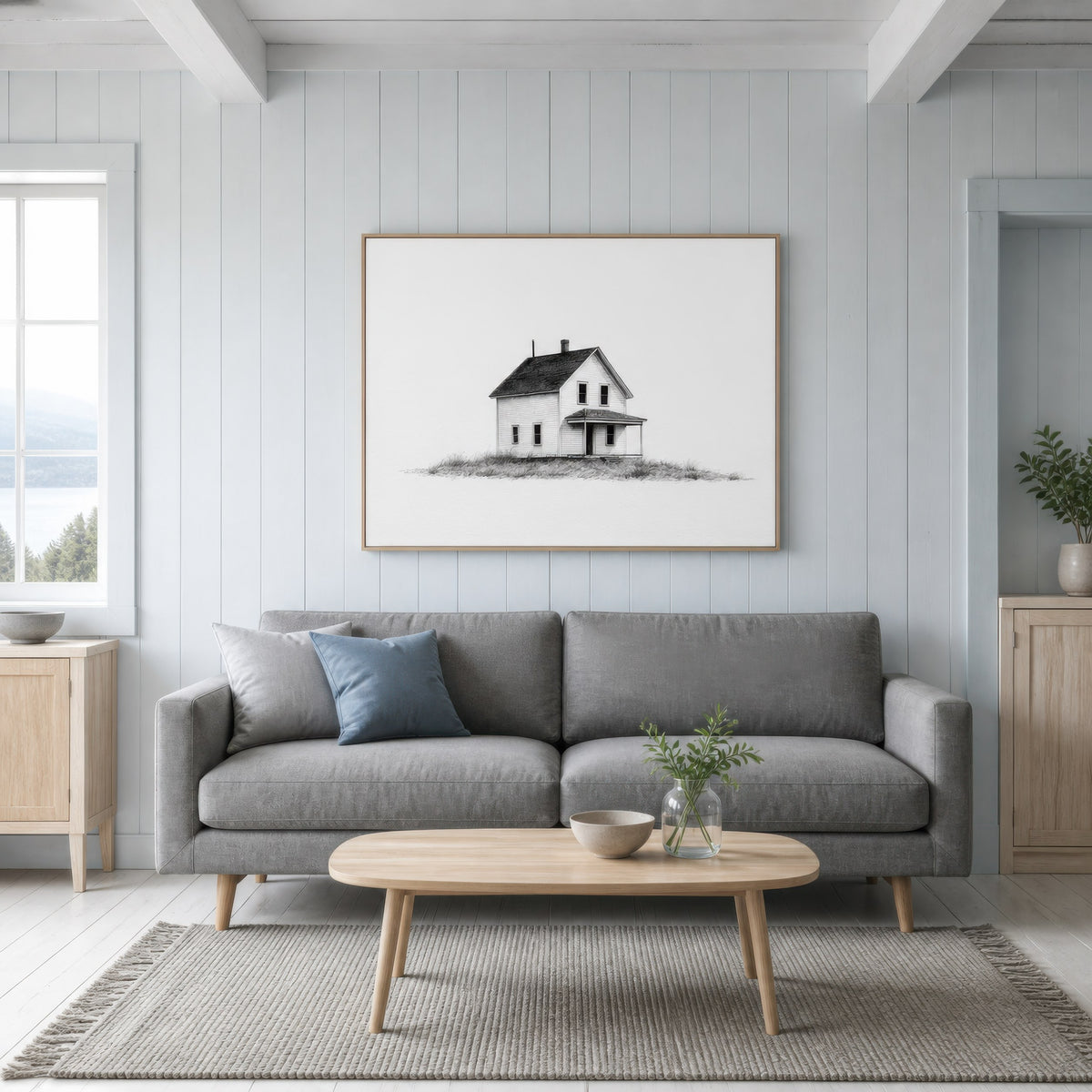 Farmhouse with a flat-roofed porch above a grey sofa with an oval pale wood coffee table
