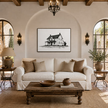 Farmhouse ink sketch above a white slipcovered sofa with tan pillows and brass sconces