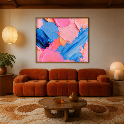 Technicolor bloom above a rust boucle sofa with a round wood table and a paper lantern