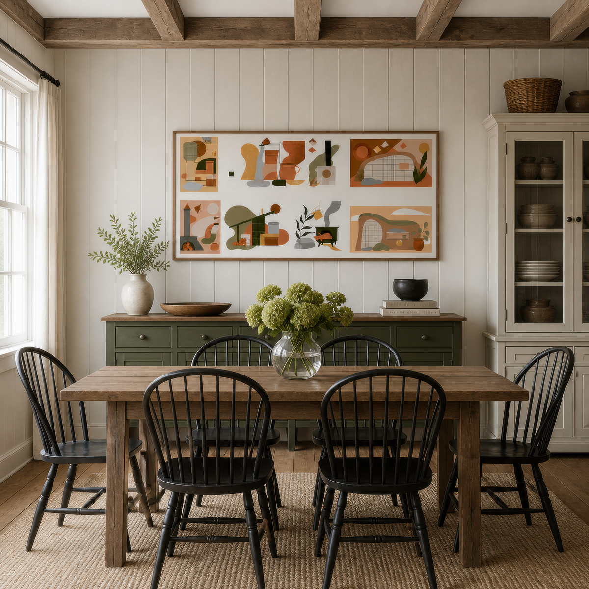Terracotta geometric collage above a dark dining table with black Windsor chairs