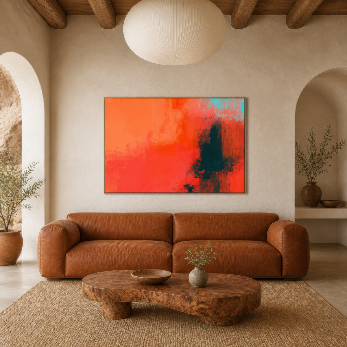 Large warm coral abstract artwork above a rust sofa with a live-edge coffee table in an arched living room