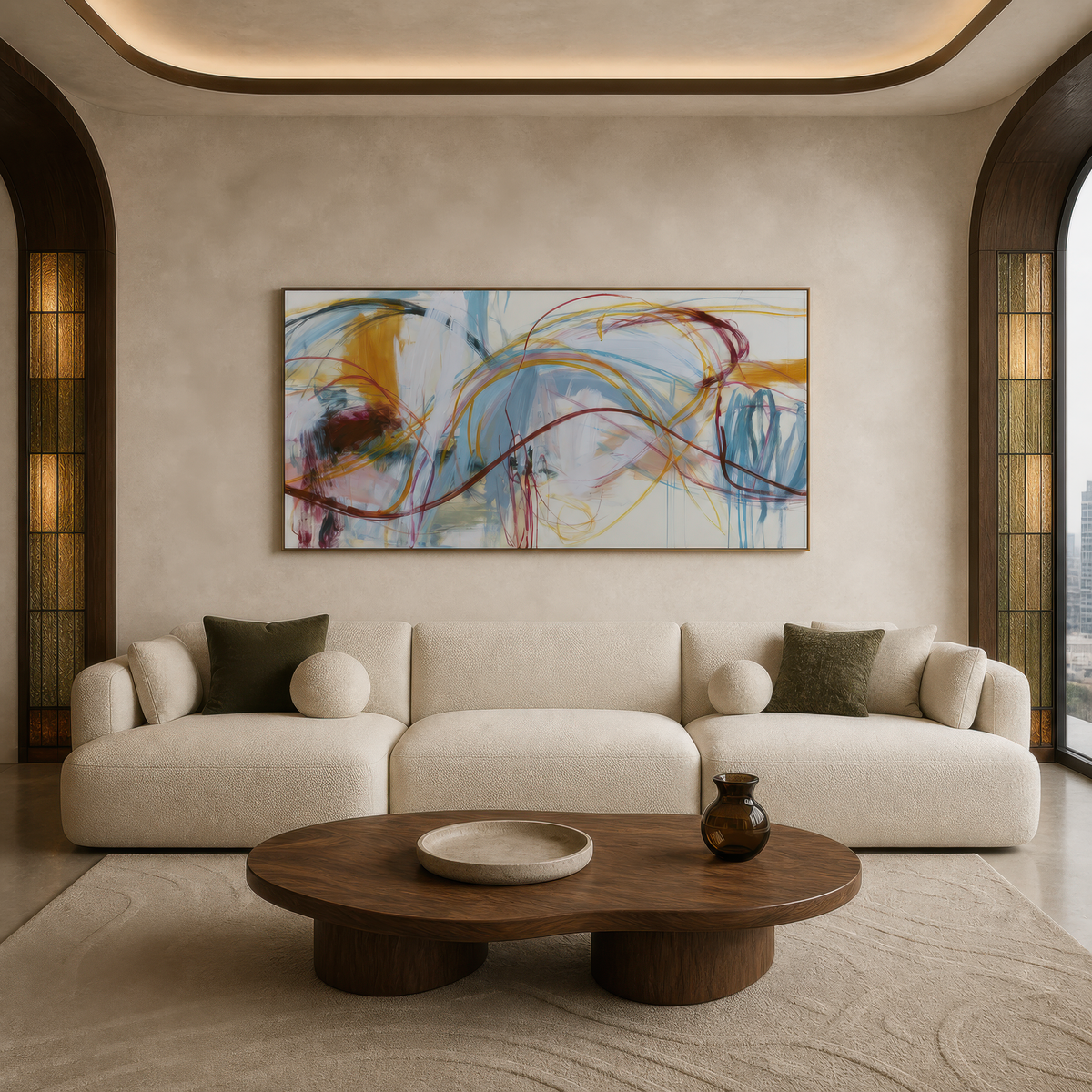 Wide burgundy wave abstract artwork above a curved white sofa in a room with arched niches
