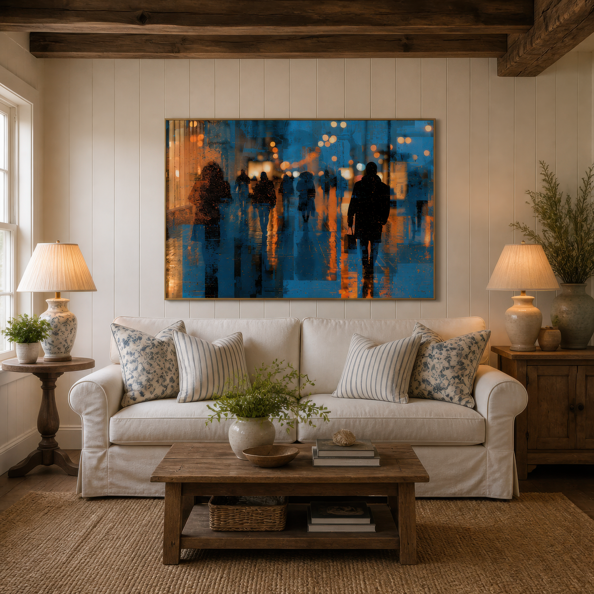 Rainy city nightscape above a white slipcovered sofa on a cream plank wall with two table lamps