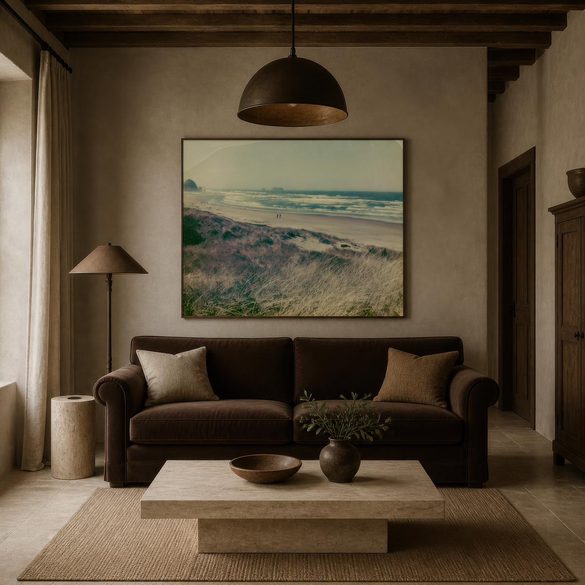 Vintage dune grass coastline above a dark brown sofa with a pale stone coffee table