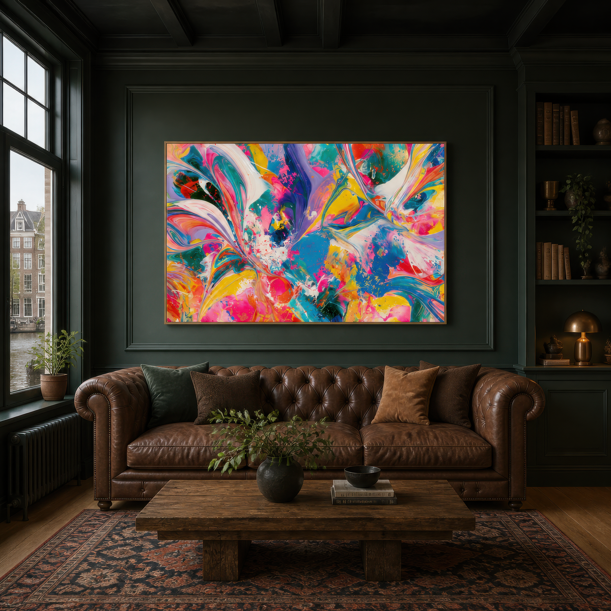 Vibrant color swirl above a brown tufted chesterfield on a dark green wall with bookcases