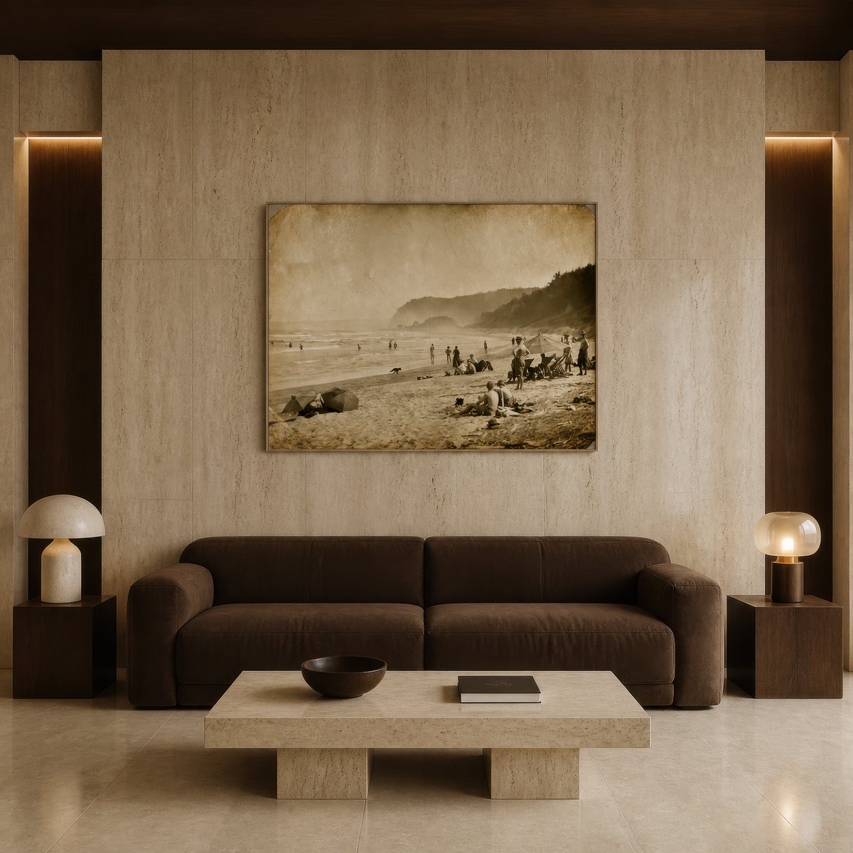 Sepia beach scene above a dark brown sofa on a travertine wall with a stone table