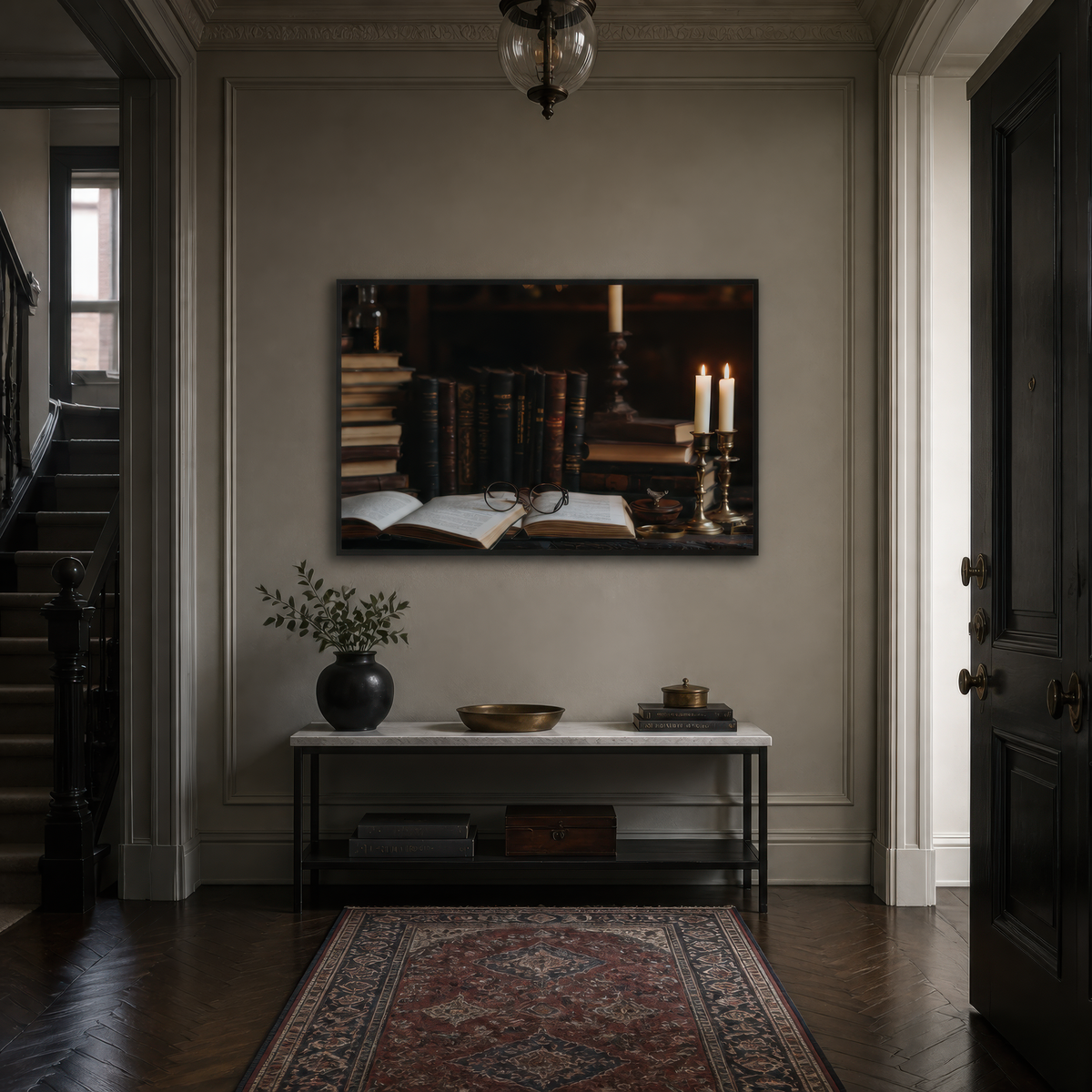 Candlelit folio above a black console in an entryway with a red Persian rug and dark door