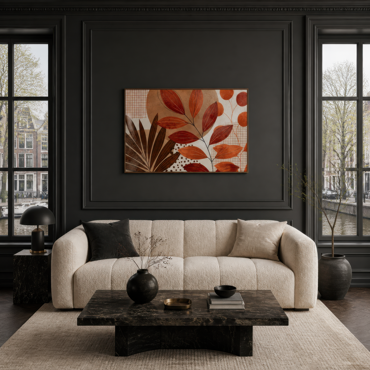 Autumn leaf collage artwork above a cream boucle sofa on a charcoal panelled wall