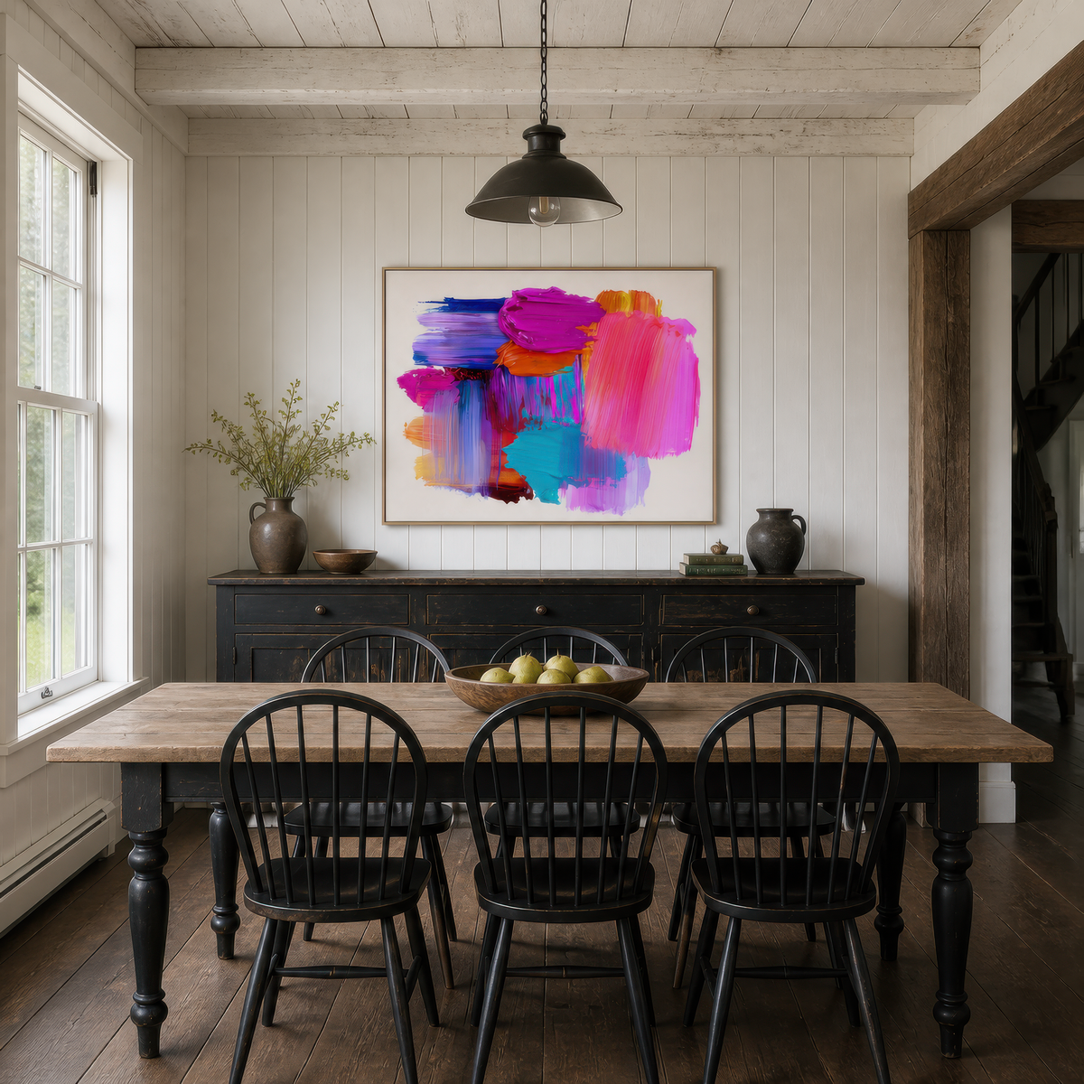 Prism pop above a wood dining table with black Windsor chairs and a black sideboard