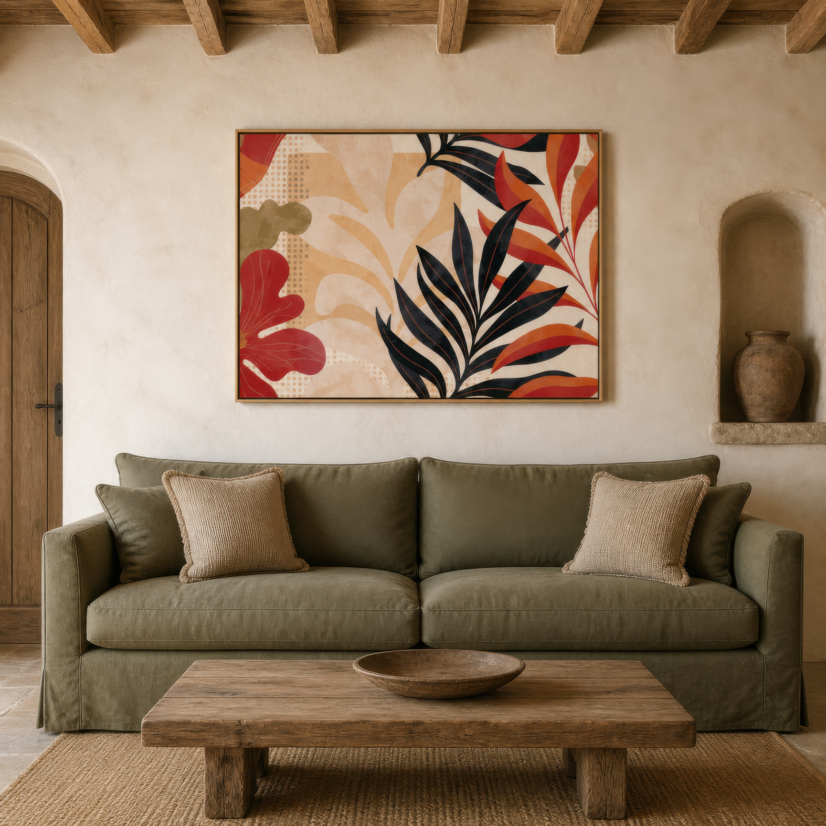Black and rust leaf artwork above a sage green sofa in a plaster room with arched niches