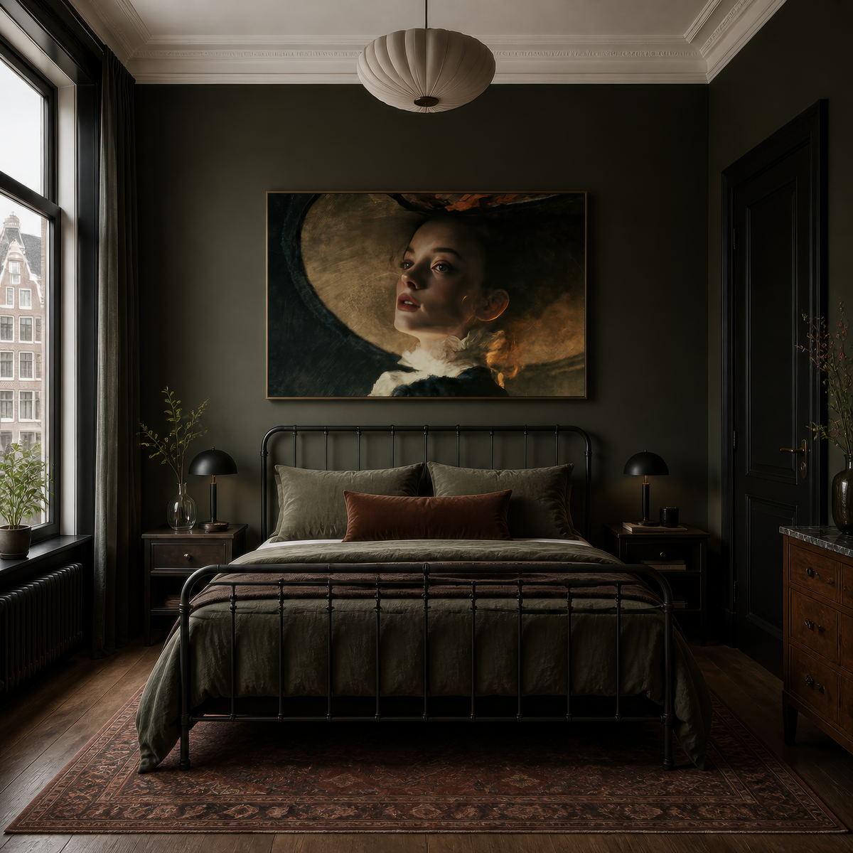Portrait in a wide hat above a black iron bed with olive bedding on a dark olive wall