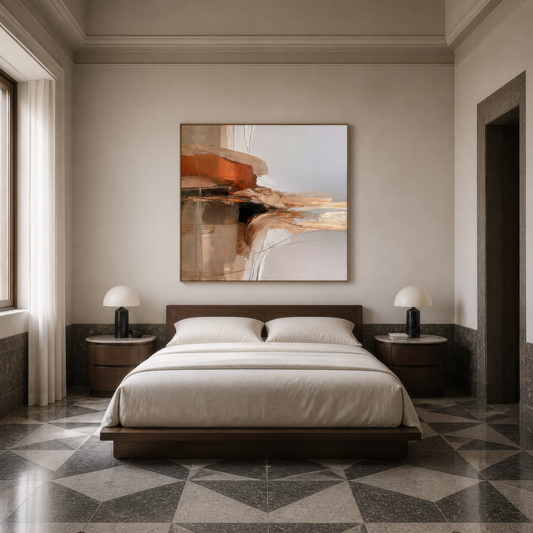 Square ochre and rust abstract artwork above a low platform bed on a patterned tile floor