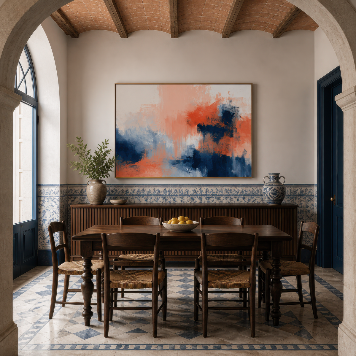 Large navy and coral abstract artwork above a sideboard in a dining room with blue and white tiles