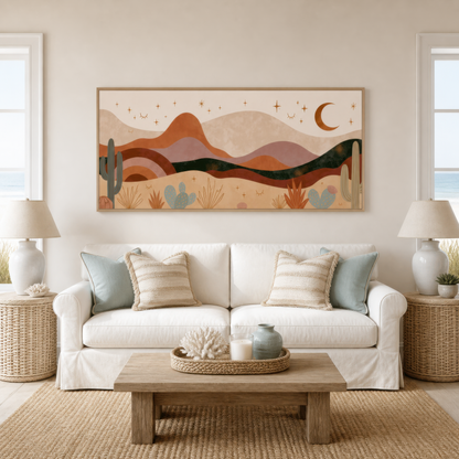 Desert night mountains above a white slipcovered sofa with a wood coffee table