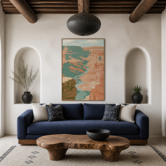 Wide river between canyon walls above a navy sofa between two plaster niches