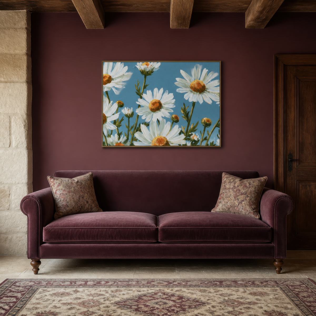 Daisies in bloom above a burgundy velvet sofa on a deep plum wall with a patterned rug