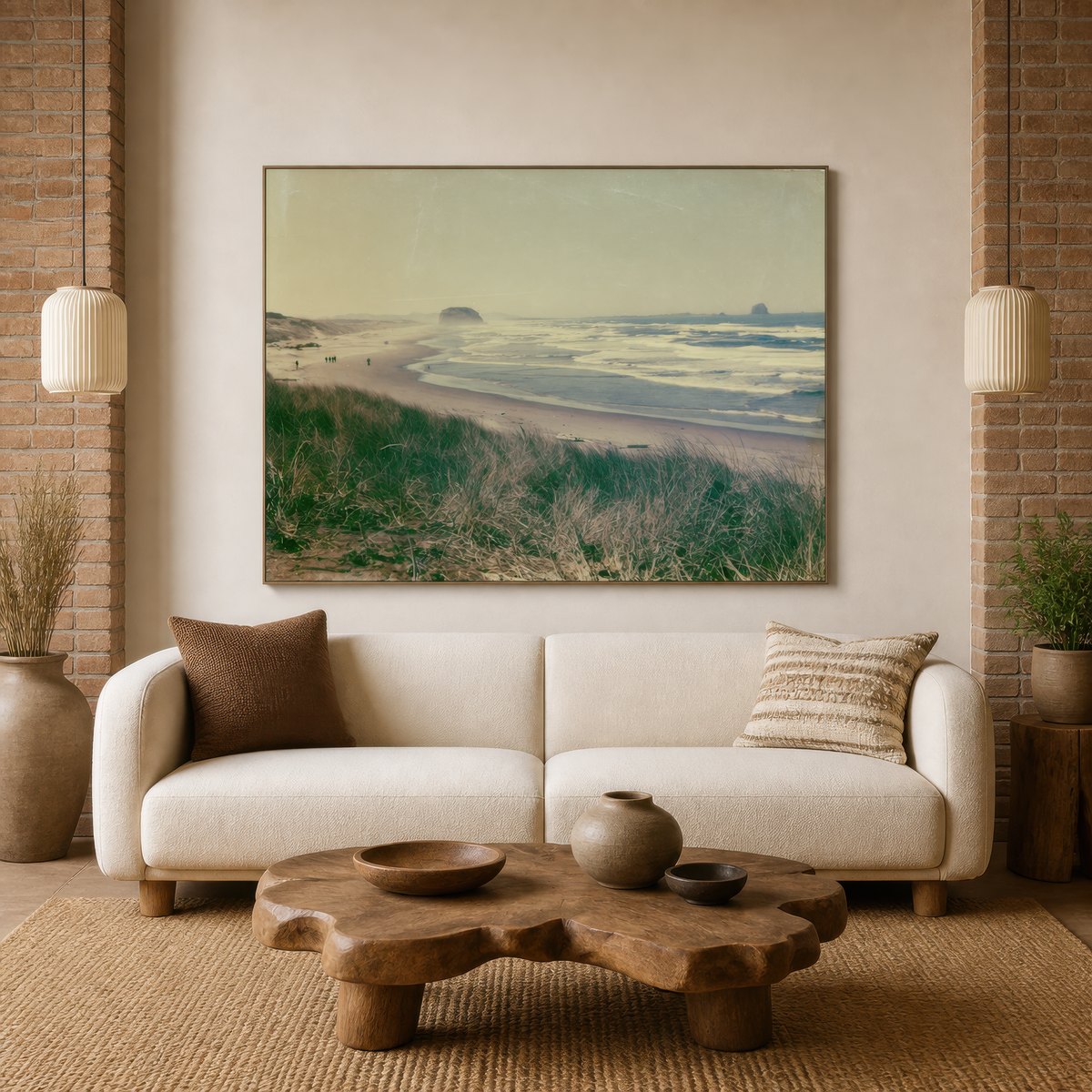 Coastal dune grasses above a cream bouclé sofa with a carved wood coffee table