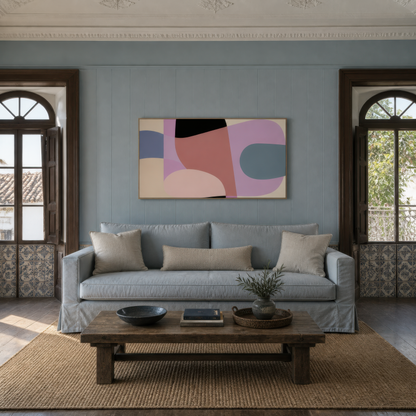 Wide mauve and lavender abstract artwork above a gray sofa on a pale blue wall