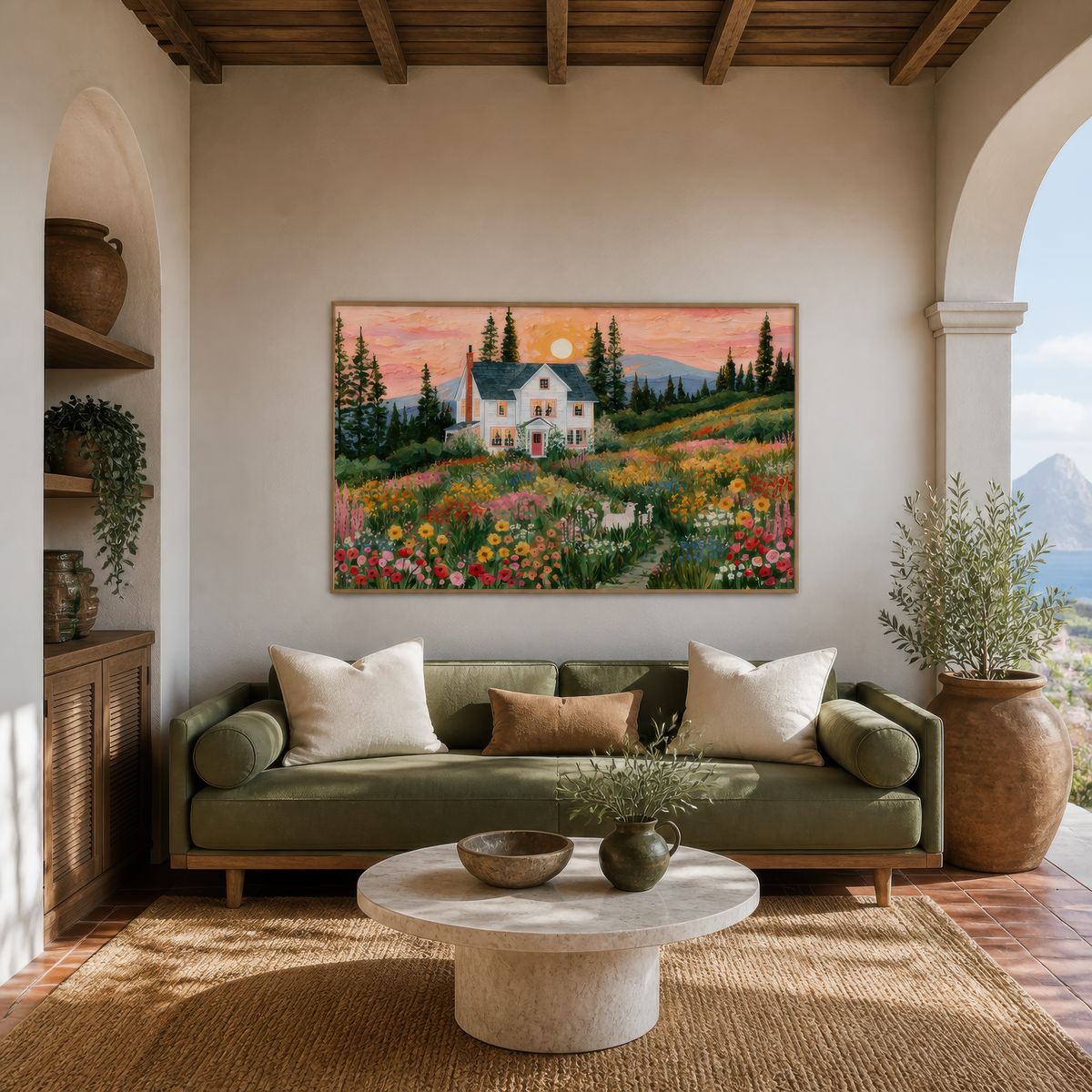 Farmhouse at sunset above an olive green sofa with a round plaster coffee table