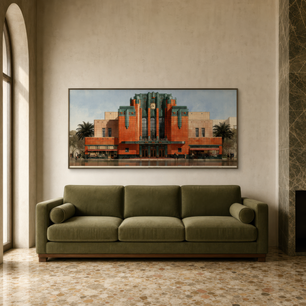 Terracotta deco theater above an olive green sofa on a cream plaster wall with a column