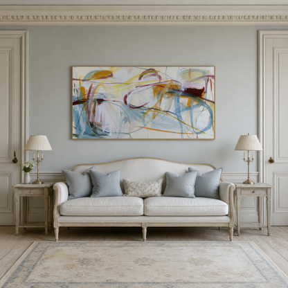 Wide mustard, burgundy and blue-gray loops abstract artwork above a cream camelback sofa on a pale gray wall