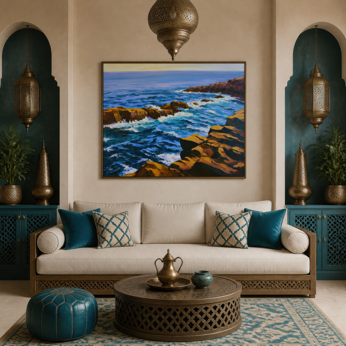 Rugged sea cliffs above a cream sofa with teal pillows and two brass lanterns