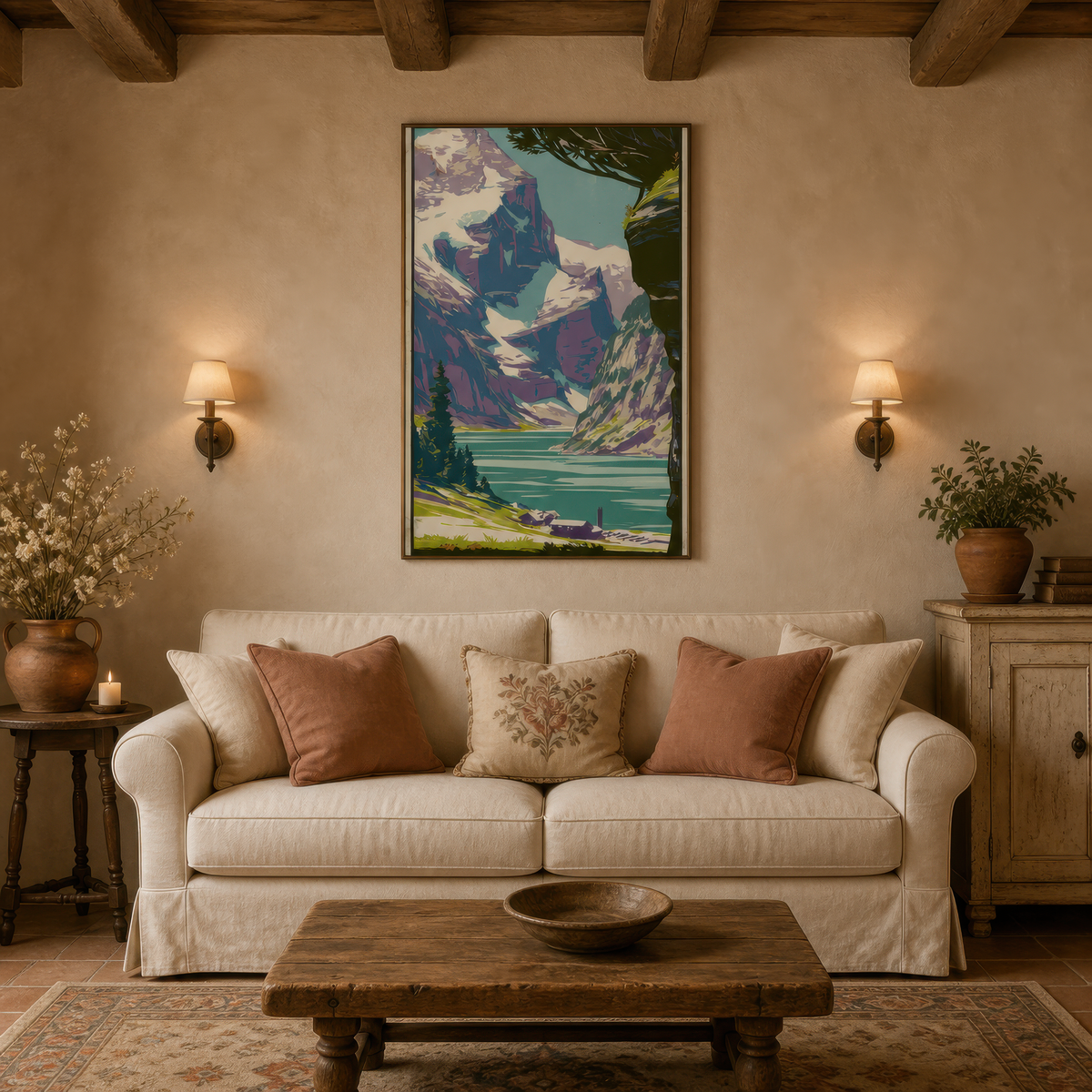 Alpine lake retro poster above a cream sofa with blush pillows and two wall sconces