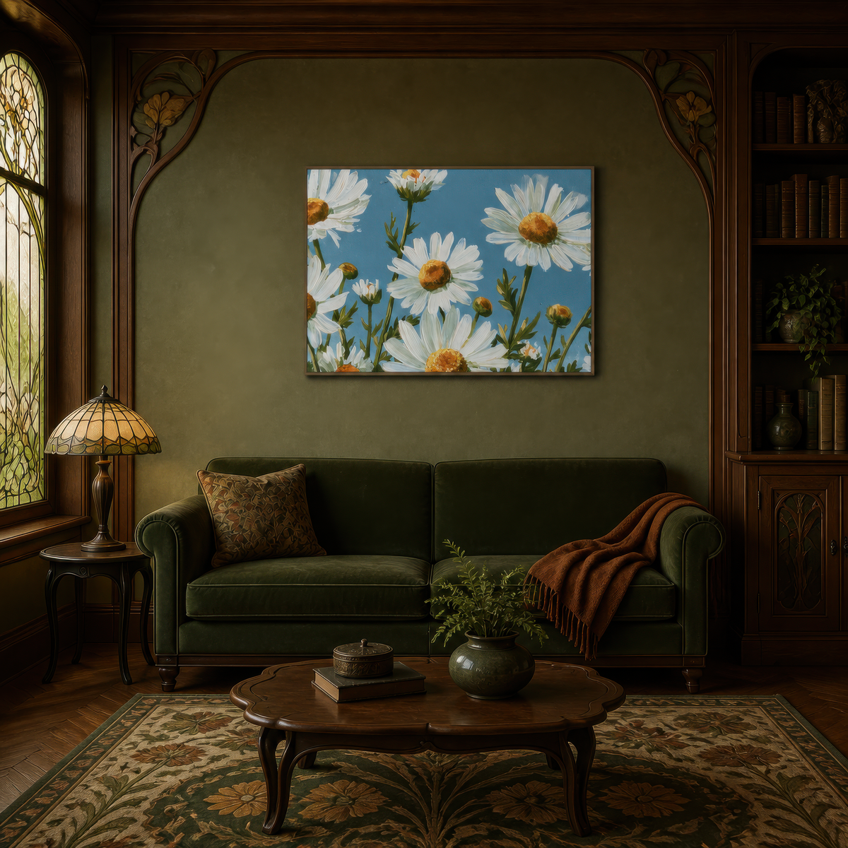 Daisies in bloom above an olive green sofa with a rust throw on an olive art nouveau wall