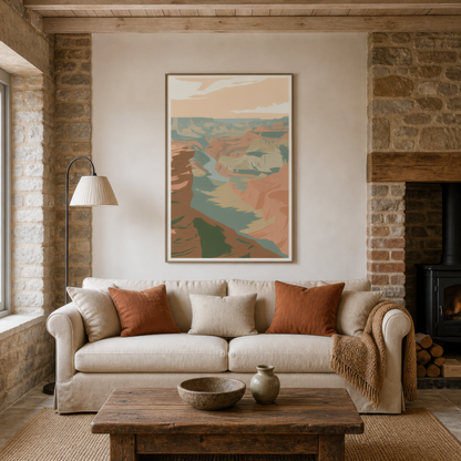 Golden canyon illustration above a cream sofa with rust pillows by a wood stove